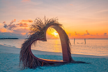 Heart-shaped sunset tropical beach love couple celebrating honeymoon, anniversary, calm ocean view, palm trees tropical destination, summer vacation travel romantic paradise scenic seaside background