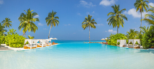 Luxury summer vacation beach resort leisure lifestyle features infinity pool palm trees calm ocean view tropical travel leisure relaxation sunny coastal landscape background. Remote tranquil wallpaper