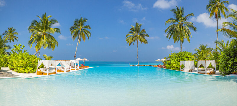 Luxury summer vacation beach resort leisure lifestyle features infinity pool palm trees calm ocean view tropical travel leisure relaxation sunny coastal landscape background. Remote tranquil wallpaper - Powered by Adobe
