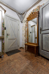Rustic Hallway Interior with Wooden Door and Mirror Bench