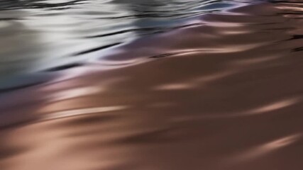 Smooth undulating waves of metallic fluid surface reflect soft studio lighting creating abstract warm hues - Powered by Adobe