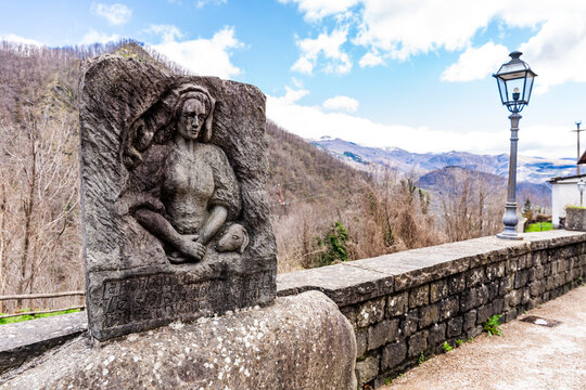 Marble sculpture depicting the shepherdess poet Beatrice di Pian degli Ontani, in the quiet mountain village of Pian degli Ontani, province of Pistoia, Tuscany region, Italy