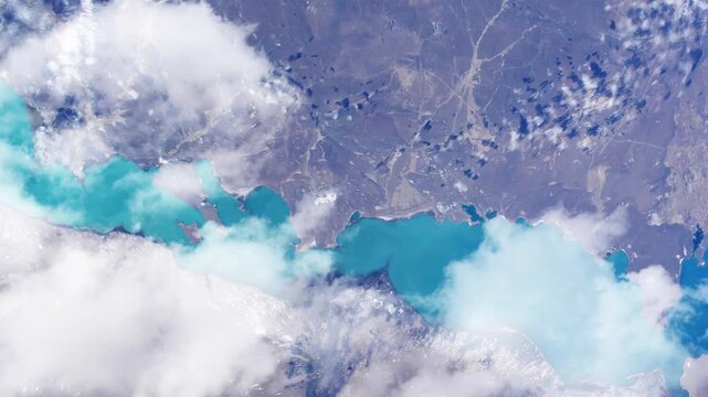 Lake Balkhash, Kazakhstan Flying Over in arid desert with moving clouds. Based on NASA Imagery Animation