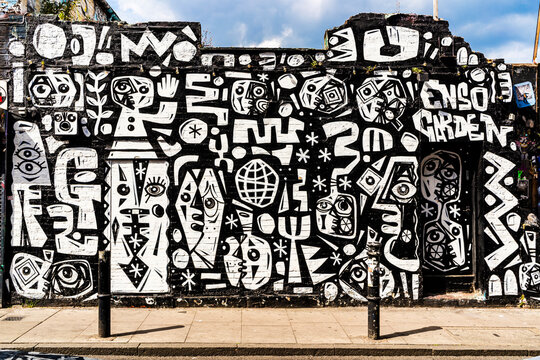 Black and white mural on a wall on Hanbury Street, near Brick Lane in the East End, a famous cultural landmark in London, England, United Kingdom