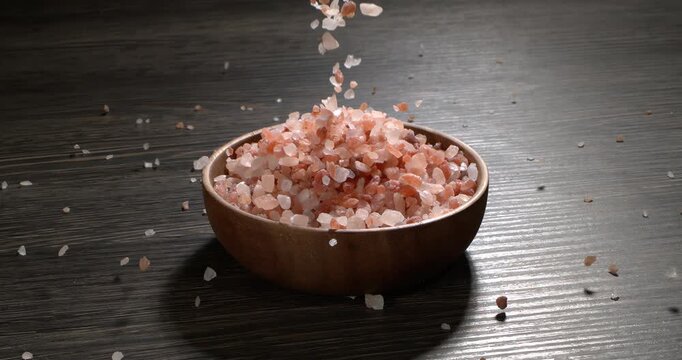 Himalayan pink salt in a super slow motion, natural mineral seasoning for healthy cooking and spa concepts. Super slow motion 1500 fps.