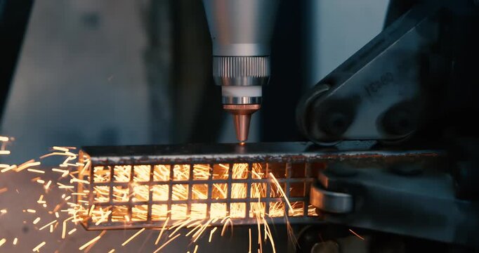 CNC Laser cutting of metal, modern industrial technology Making Industrial Details. Shot on super slow motion camera 1000 fps.