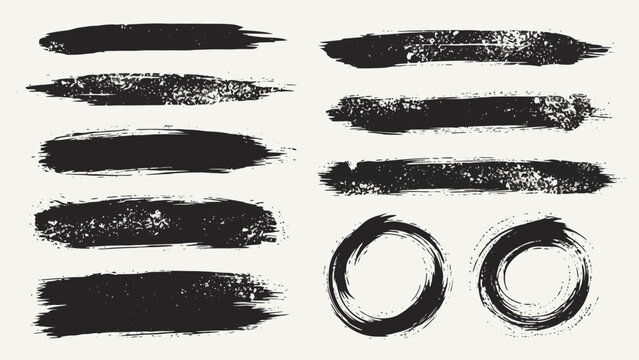 A collection of black brush stroke textures and circular ink marks on a light background.