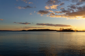 Sunset over Balaton Lake in Hungary with clouds in the sky