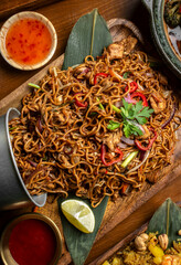 pad thai chicken stir fry noodles in modern restaurant in thailand