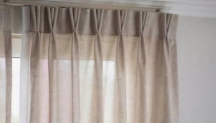 Close medium shot featuring pinch pleat curtain header style emphasizing stitched pleats adding classic structure and tailored appearance to window treatments.