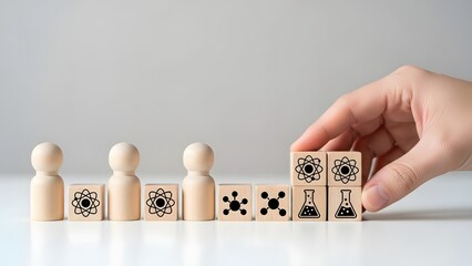 Fostering scientific teamwork and innovative breakthroughs with symbolic wooden blocks depicting molecular and atomic progress, illustrating a structured approach to research and development