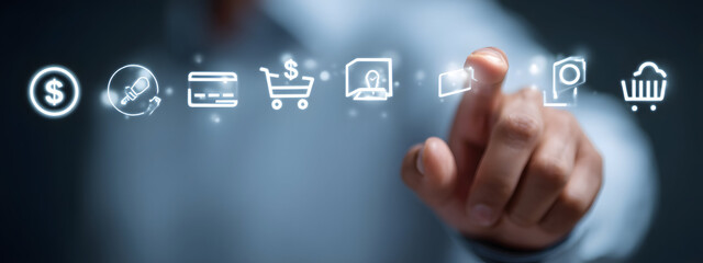 Person's hand interacts with a futuristic digital interface showing various e-commerce and financial transaction icons, symbolizing modern online shopping and digital economy concepts