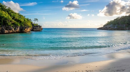 A breathtaking coastal view showcases turquoise waters gently lapping against a pristine white sand beach framed by lush cliffs
