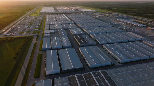 Massive Logistics Hub: Aerial Sunset View of a Modern Warehouse Complex