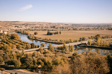 Obraz premium High angle view of the Tagus River winding through the Toledo countryside, infrastructure and landscape.