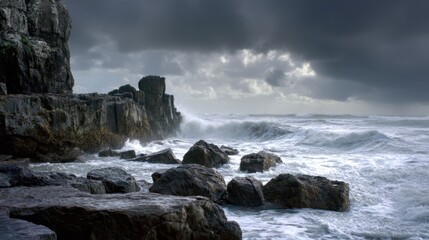 Dramatic coastal seascape with rocky cliffs and stormy ocean waves.