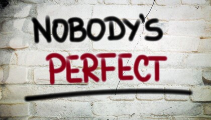 Fototapeta premium Inspirational message 'Nobody's Perfect' spray-painted on a rustic brick wall, emphasizing acceptance and the beauty of human imperfection