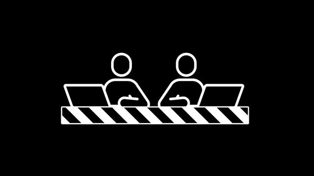 Two colleagues sit side by side at a shared desk while working on their laptops to complete a collaborative project within a modern office workspace