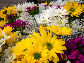 Colorful Daisy and Carnation Flower Bouquets with Decorative Wrapping.
