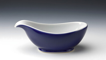 Elegant Gravy Boat: A sleek, blue and white gravy boat, its curved design and refined features speak of culinary artistry and sophistication.