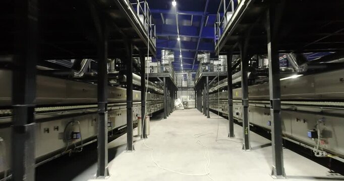 Ceramic Tile Roller Kiln. A production line or conveyor at a ceramic and porcelain tile factory. Ceramic Tile Making. Modern roller kiln (tunnel furnace) for firing ceramic tiles and porcelain tiles. 