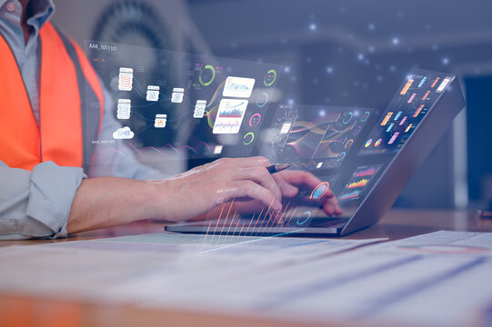 DevOps engineer in Digital transformation technology strategy of business processes and data, Engineer wearing safety vest typing on computer laptop working with ai technology diagram. - Powered by Adobe