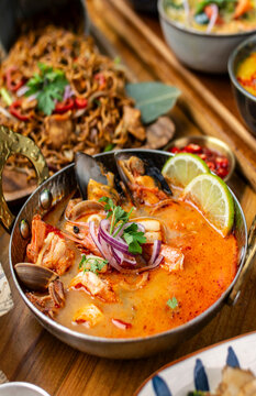mixed seafood tom yum thai curry soup indoors ina a phuket thailand restaurant