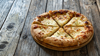 Pizza Bianca white pizza with oregano on wooden table