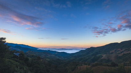 Beautiful panorama landscape skyline of Doi Sakad mountain valley with fog at sunrise sky in Pua Nan Thailand Winter travel season concept