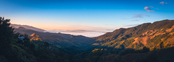 Beautiful panorama landscape skyline of Doi Sakad mountain valley with fog at sunrise sky in Pua Nan Thailand Winter travel season concept
