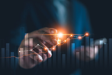 Business growth, finance and investment concept, Business man analyzing and calculating tax, interest rate, financial data with economic graph growth chart result, strategy and budget planning.