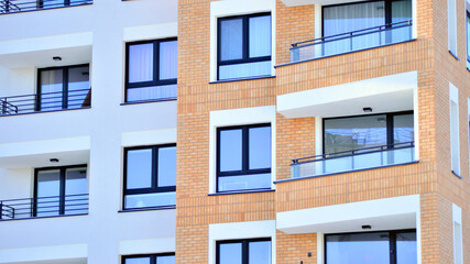 Fototapeta premium Downtown modern residential architecture. Architectural details of modern apartment building. Modern european residential apartment building complex.