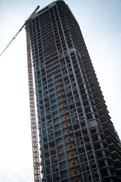 Tall modern building being built from concrete. High quality photo