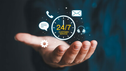 Person's hand supporting a glowing 24/7 customer service digital interface help assistance