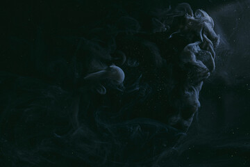 Abstract dark matter, black background. Moving flow of smoke and paints