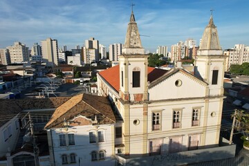 Obraz premium Aerial view of Nossa Senhora do Rosario Church in Taubate, Brazil, 18th century historic colonial church under sunny blue sky