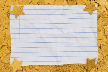 Lined paper note on gold star background