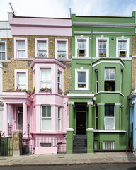 Facade of the famous pastel colored houses in Notting Hill, London
