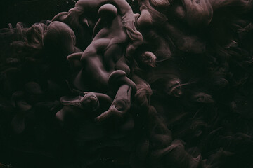 Abstract dark matter, black background. Moving flow of smoke and paints