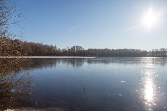 Sun shining on the lake Grube Fernie on a cold winter day in January 2026, near Gie&szlig;en, Hessen