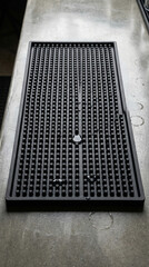 Black rubber mat on industrial countertop in commercial kitchen  