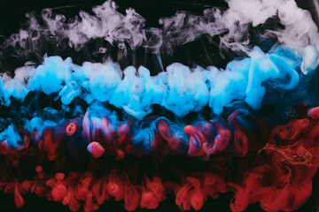 Abstract colorful smoke background. Moving flow of blue, red, white paints, fluid art