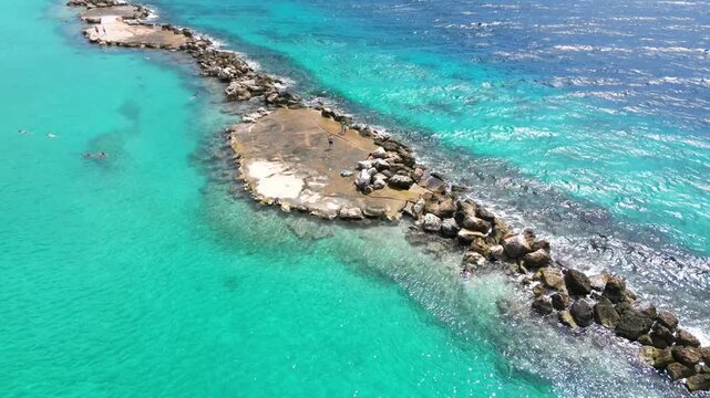 Areial 4K Drone View of Turquoise water and Rocky Bay in Cura&ccedil;ao, Mambo Beach