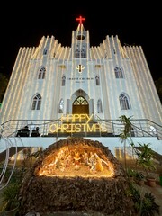 Christ Church in Chennai during its Christmas celebrations, featuring a nativity scene at the base and festive lighting.