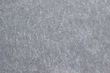 Crystals of frozen water. Gray background.