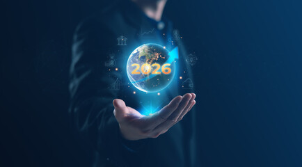 Businessman presenting a digital globe with 2026 highlighted, symbolizing future planning, global strategy, financial growth, and technology driven business vision in a modern corporate environment.