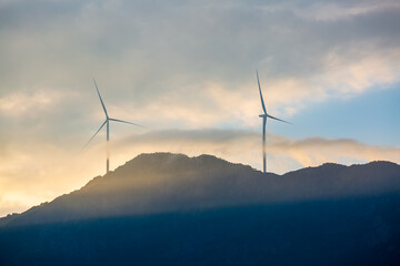 Wind turbines sunset landscape on Bailong Mountain, Lan County, Shanxi, China