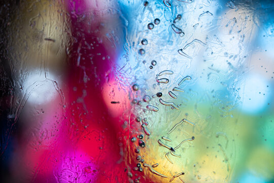 Macro Texture of Melting Ice Crystals Over Vibrant Rainbow Backg - Powered by Adobe