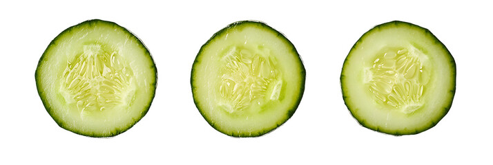 Three slices of fresh green cucumber viewed from the front showing internal texture and seeds on a white... isolated on a transparent background
