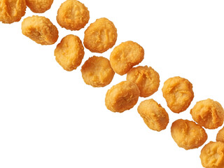 Fototapeta premium Golden fried chicken nuggets arranged in a diagonal line isolated on white background